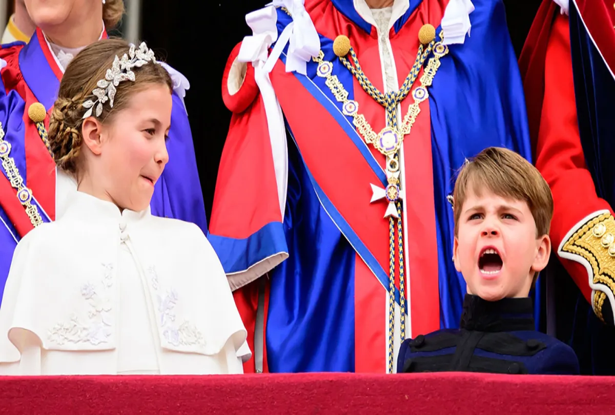 Princess Charlotte of Wales and Britain's Prince Louis of Wales stand on the Buckingham Palace balcony as they wait for the Royal Air Force fly-past in central London on May 6, 2023, after the coronations of King Charles III and Queen Camilla. Leon Neal / POOL / AFP