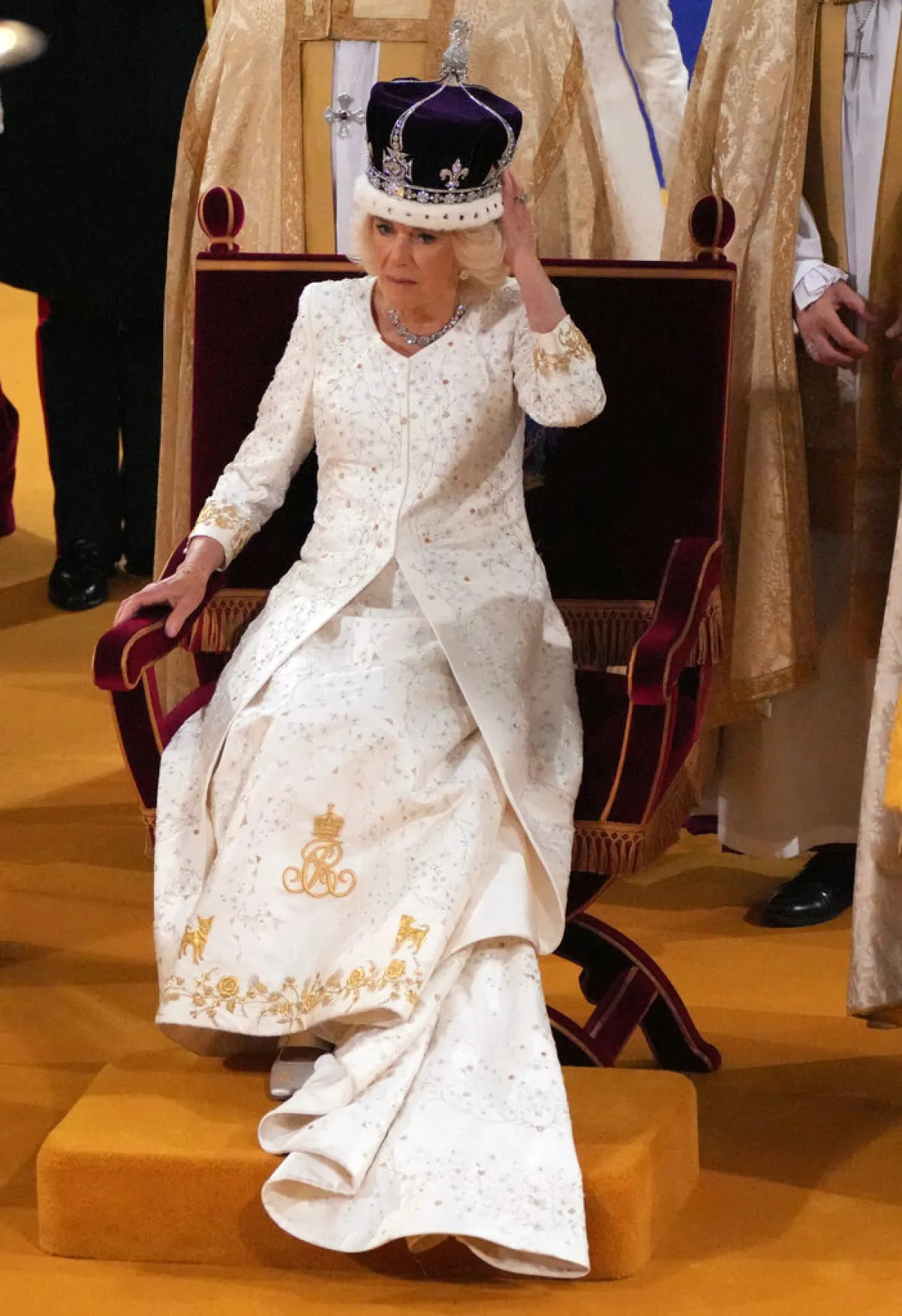 Britain's Camilla sits on the throne wearing a modified version of Queen Mary's Crown during the Coronation Ceremony inside Westminster Abbey in central London, on May 6, 2023.  Aaron Chown / POOL / AFP
