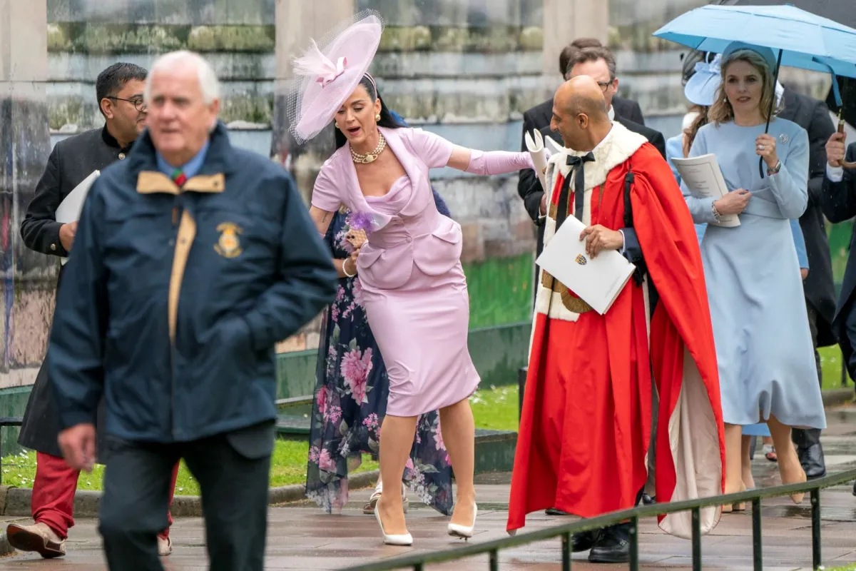 Katy Perry stumbles as she leaves Westminster Abbey following the coronation ceremony of King Charles III and Queen Camilla in central London on May 6, 2023. Jane Barlow / POOL / AFP