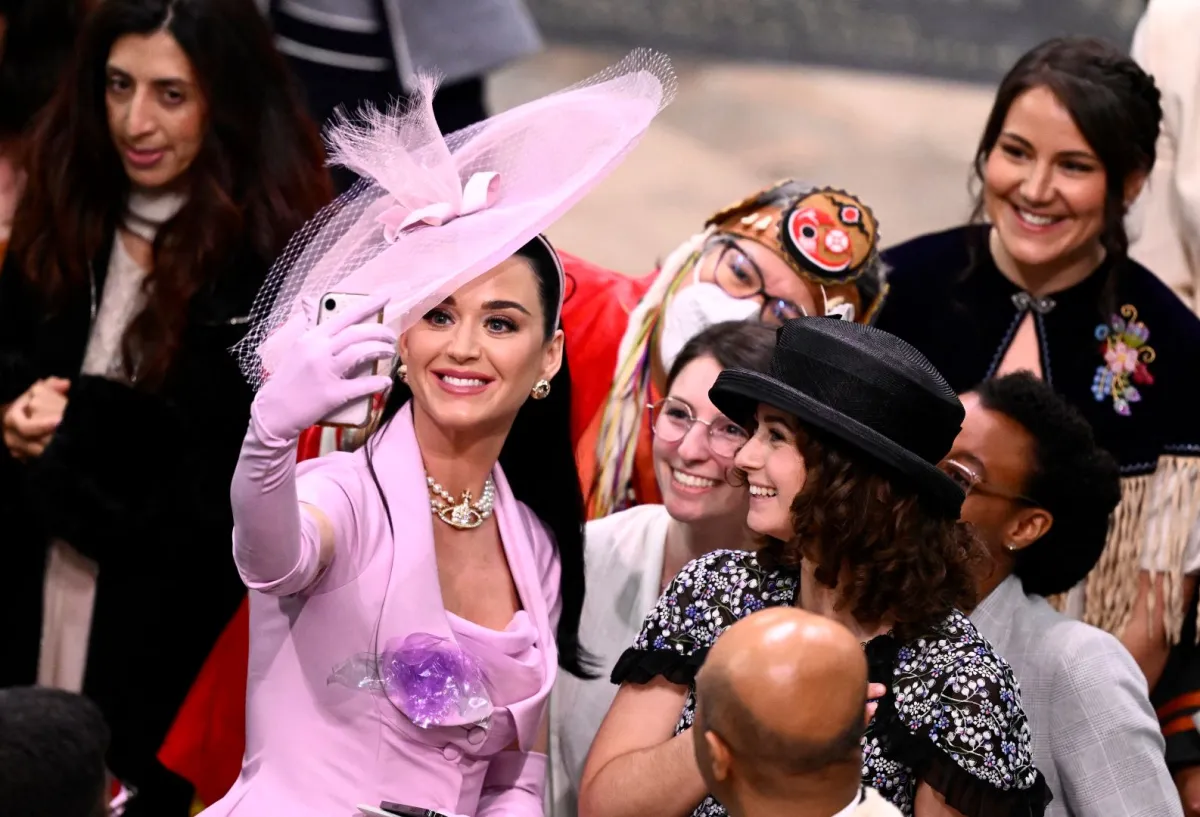 Katy Perry takes selfie photos with guests at Westminster Abbey in central London on May 6, 2023. Gareth Cattermole