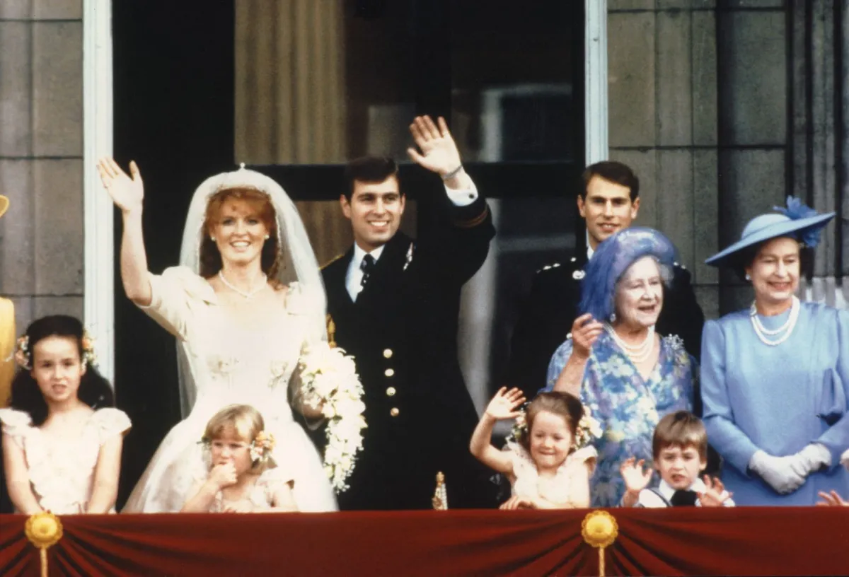 Prince Andrew and his wife Sarah Ferguson wave to crowds 23 July 1986 from the balcony of Buckingham Palace in London. PA / AFP