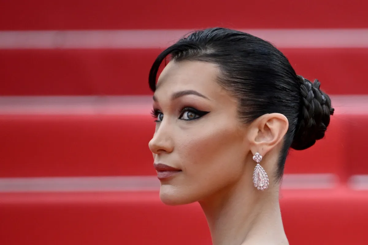 US model Bella Hadid arrives for the screening of the film "The Innocent (L'Innocent)" during the 75th edition of the Cannes Film Festival in Cannes, southern France, on May 24, 2022. (Photo by LOIC VENANCE / AFP)