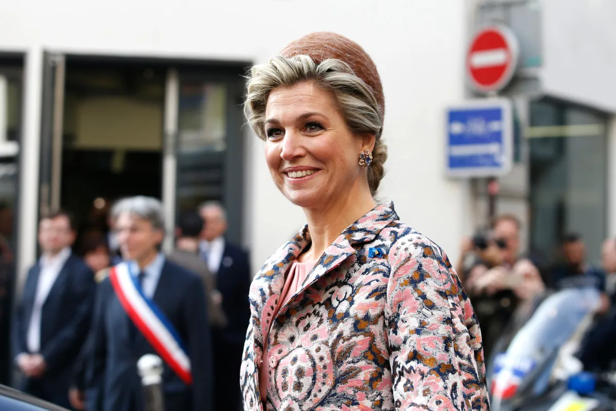 Dutch Queen Maxima smiles on March 11, 2016 after visiting the so-called "incubator" of the French high-tech start-up "Numa" in Paris, as part of a state visit to France. (Photo by CHARLES PLATIAU / POOL / AFP)