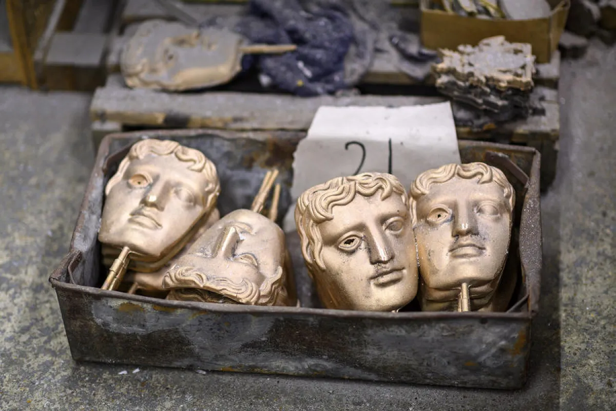 BAFTA (British Academy of Film and Television Arts) masks waiting to be fettled are pictured during a photo call at the New Pro Foundries, west of London, on January 21, 2020, ahead of the British Academy Film Awards 2020. JUSTIN TALLIS / AFP