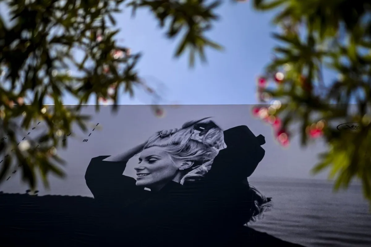 This photograph taken in Cannes, southeastern France, on May 15, 2023, shows the official poster of the 76th Cannes Film Festival. (Photo by Patricia DE MELO MOREIRA / AFP)