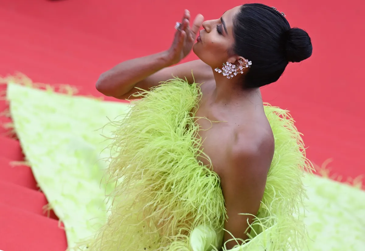 Indian influencer Farhana Bodi blowss kisses as she arrives for the opening ceremony and the screening of the film "Jeanne du Barry" during the 76th edition of the Cannes Film Festival in Cannes, southern France, on May 16, 2023. (Photo by Antonin THUILLIER / AFP)