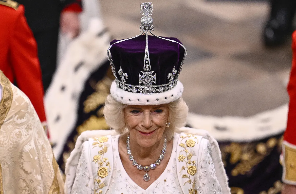 Britain's Camilla smiles as she wears a modified version of Queen Mary's Crown during the Coronation Ceremony inside Westminster Abbey in central London, on May 6, 2023. .Gareth Cattermole / POOL / AFP