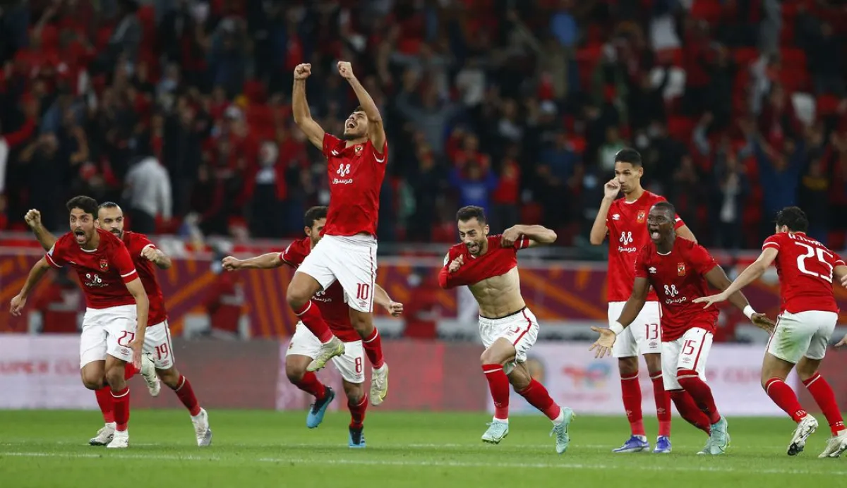 African Super Cup - Final - Al Ahly SC v Raja Casablanca - Ahmed bin Ali Stadium, Al Rayyan, Qatar - December 22, 2021 Al Ahly's Mohamed Sherif and teammates celebrate after winning the penalty shoot-out REUTERS/Amr Abdallah Dalsh - أرشيفية من رويترز