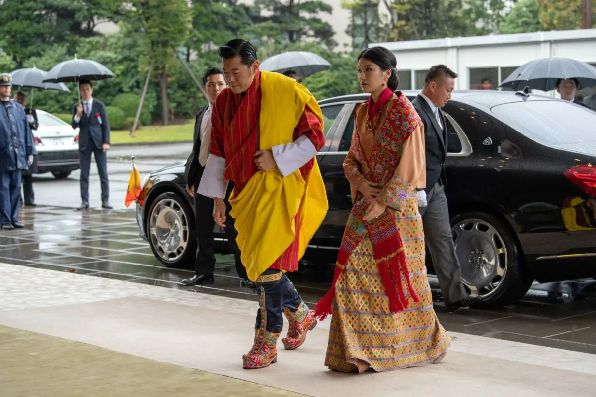 الملك جيغمي خيسار نامجيل وانجتشوك والملكة جيتسون بيما (King Jigme Khesar Namgyel Wangchuck and Queen Jetsun Pema). مصدر الصورة:/ AFP / POOL / Carl Court