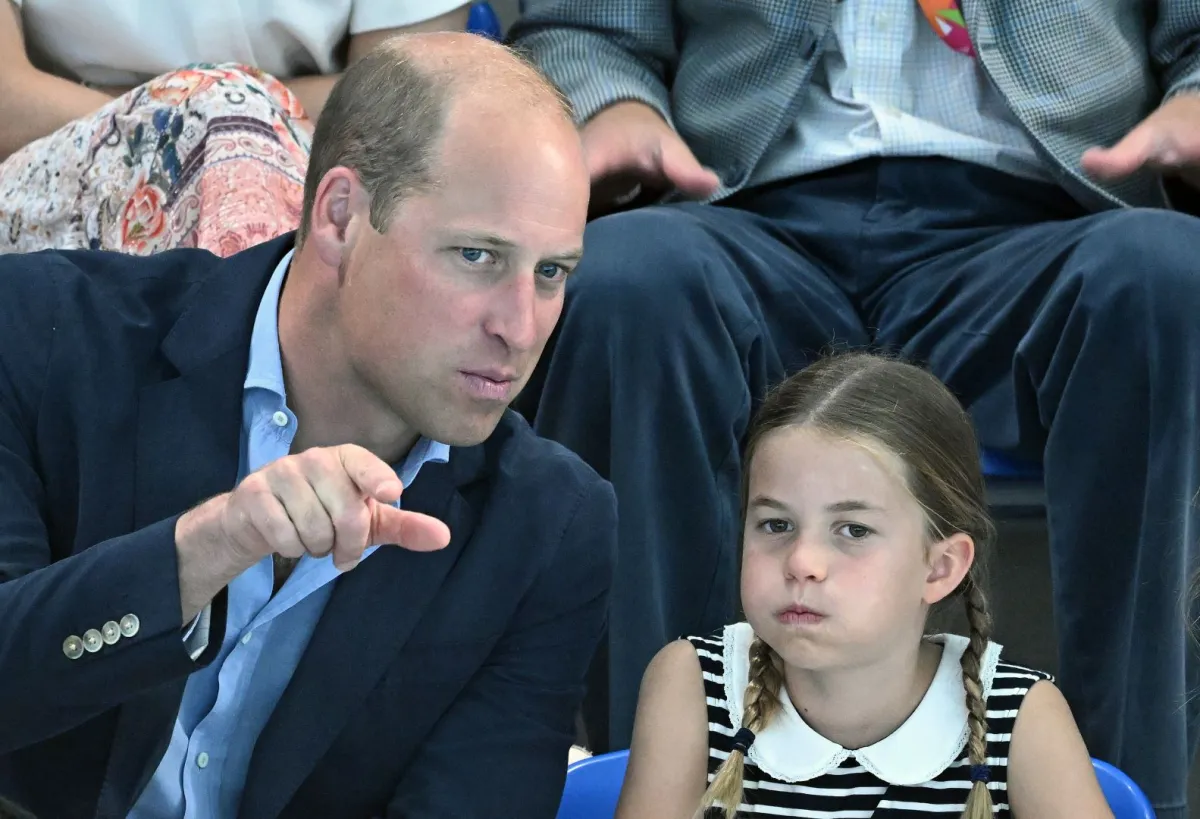 الأمير ويليام وابنته الأمييرة شارلوت (Princess Charlotte and Prince William). مصدر الصورة: Oli SCARFF / AFP