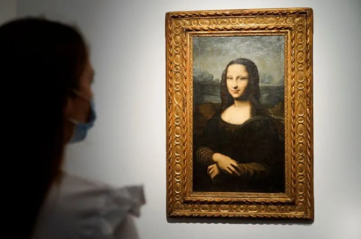 a reproduction of Leonardo Da Vinci's Mona Lisa, painted on canvas by an unknown artist from the 17th century and up for an online sale at Christie’s auction house in Paris, France, June 11, 2021. REUTERS/Lucien Libert Acquire Licensing Rights