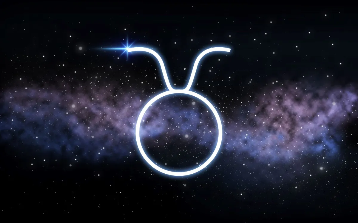 رمز برج الثور مع خلفية مظلمة ونجوم