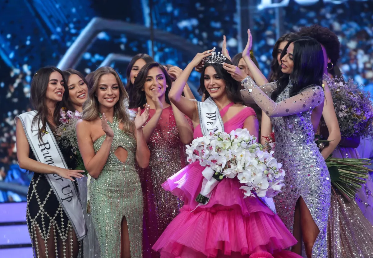 Miss Lebanon 2022 Yasmina Zaytoun is crowned by Miss Lebanon 2018 Maya Reaidy at the Forum de Beyrouth in the capital Beirut, on July 24, 2022. (Photo by ANWAR AMRO / AFP)
