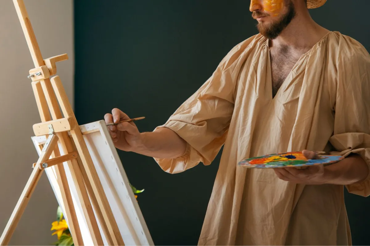 فنان يرسم لوحة بألوان زيتية