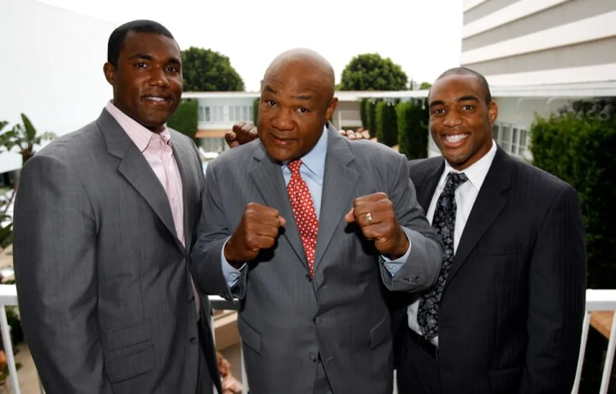 Former heavyweight champion George Foreman (C) and his sons George Foreman III (L) and George Foreman IV pose during the Television Critics Association 2008 summer press tour in Beverly Hills, California July 9, 2008. REUTERS/Mario Anzuoni/File Photo Purchase Licensing Rights