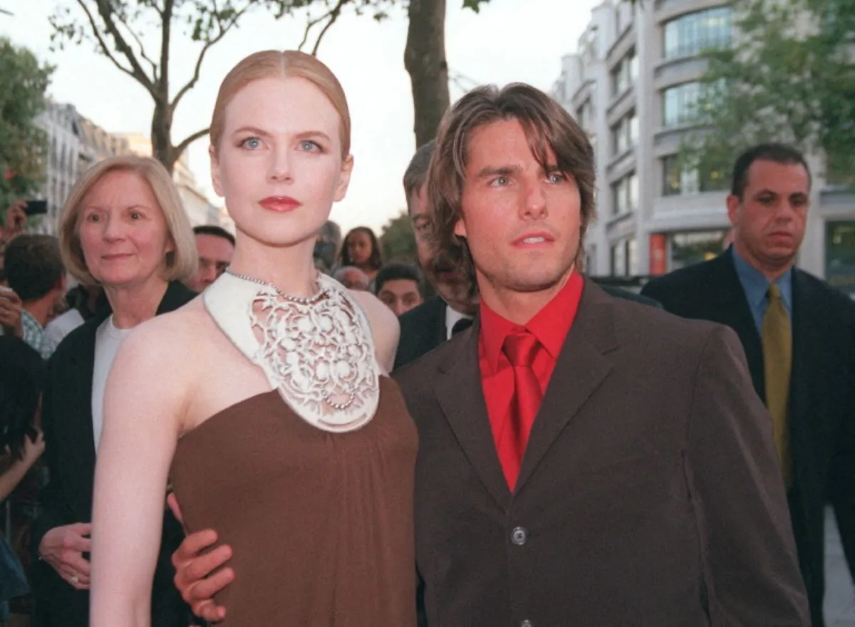 نيكول كيدمان وتوم كروز في شارع الشانزليزيه في باريس (Nicole Kidman and Tom Cruise on the Champs-Élysées in Paris). مصدر الصورة: JACK GUEZ / AFP