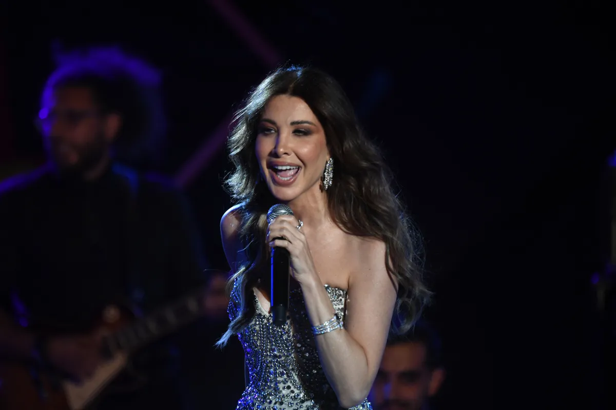  Nancy Ajram performs during the 59th edition of the Carthage International Festival at the Roman Theatre in Carthage in Tunis.  نانسي عجرم تحيي حفلًا غنائيًا خلال الدورة التاسعة والخمسين من مهرجان قرطاج الدولي على المسرح الروماني في قرطاج بتونس. مصدر الصورة: (Photo by FETHI BELAID / AFP)