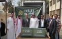 العتيق برفقة المشاركين بالتوزيع.jpg