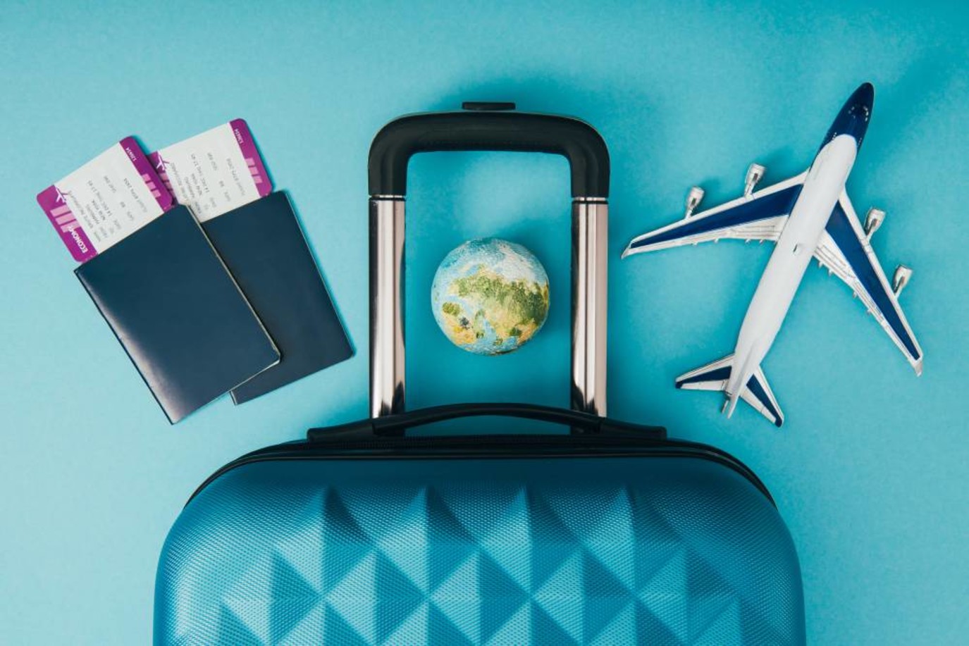 Travel suitcase and passport