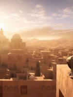 رجل يجلس على ربوة يشاهد قريته من عل