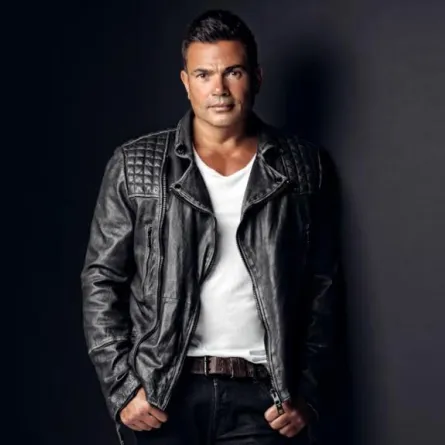 بالصور: دينا الشربيني تتهرب من التصوير مع عمرو دياب ..ورد فعل عنيف ل"الهضبة"