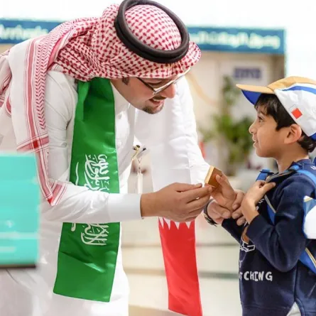 سعوديون يشاركون في الاحتفال باليوم الوطني البحريني