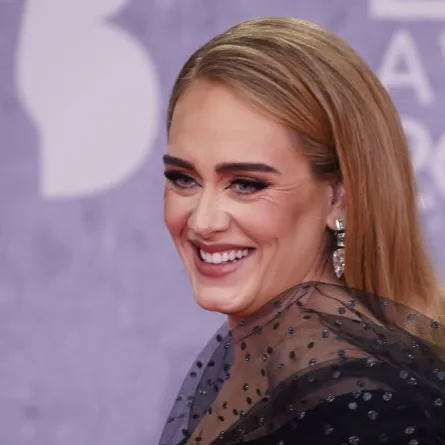 British singer Adele Laurie Blue Adkins aka Adele poses on the red carpet upon her arrival for the BRIT Awards 2022 in London on February 8, 2022. NIKLAS HALLE'N / AFP