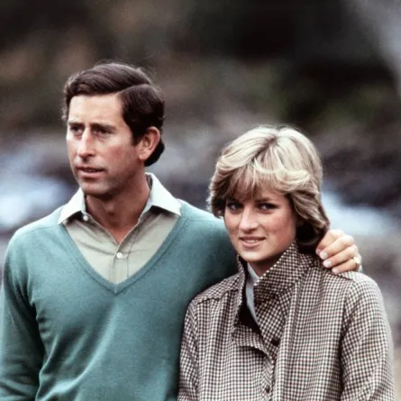 Prince Charles, Prince of Wales, wearing a kilt, and Diana, Princess of Wales, pose for photographers beside the River Dee in Scotland during their post-honeymoon visit to the Royal Residence at Balmoral Castle, on August 19, 1981. POOL / AFP
