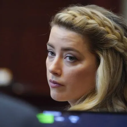 Actor Amber Heard arrives for closing arguments in the Depp v. Heard trial at the Fairfax County Circuit Courthouse in Fairfax, Virginia, on May 27, 2022. Actor Johnny Depp is suing ex-wife Amber Heard for libel after she wrote an op-ed piece in The Washington Post in 2018 referring to herself as a “public figure representing domestic abuse.” Steve Helber / POOL / AFP