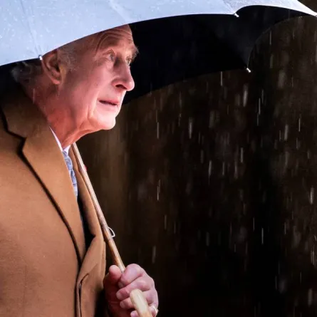 Britain's King Charles III shelters from the rain beneath an umbrella during a visit to York Minster in York, northern England on November 9, 2022 during a two-day tour of Yorkshire.Danny Lawson / POOL / AFP