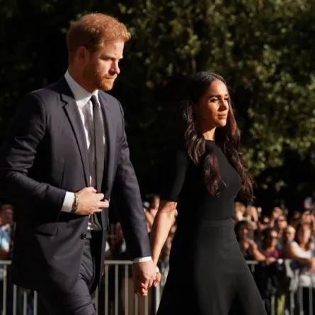Britain's Prince Harry, Duke of Sussex (L) and Meghan, Duchess of Sussex (R) arrive to look at floral tributes on the Long walk at Windsor Castle on September 10, 2022, two days after the death of Britain's Queen Elizabeth II at the age of 96. King Charles III pledged to follow his mother's example of "lifelong service" in his inaugural address to Britain and the Commonwealth on Friday, after ascending to the throne following the death of Queen Elizabeth II on September 8. Kirsty O'Connor / POOL / AFP