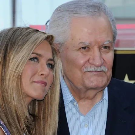 (FILES) In this file photo taken on February 22, 2012, US actress Jennifer Aniston (L) stands for a photo with her father, Greek-US actor John Aniston, during her Hollywood Walk of Fame star ceremony in Hollywood, California. Actor John Aniston, father of US actress Jennifer Aniston, has passed away at the age of 89, according to US media reports. Chris Delmas / AFP