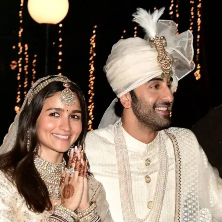 Bollywood actors Ranbir Kapoor (R) and Alia Bhatt pose for pictures during their wedding ceremony in Mumbai on April 14, 2022. SUJIT JAISWAL / AFP