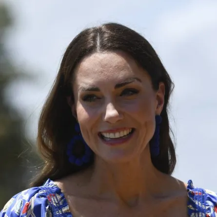 Britain's Catherine, Duchess of Cambridge, smiles upon her arrival with Britain's Prince William, Duke of Cambridge (out of frame), at Hopkins Village, Belize on March 20, 2022. Johan ORDONEZ / AFP