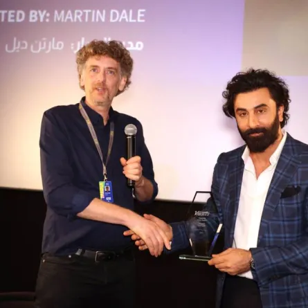 Martin Dale, who moderated an in coversation session with Indian actor Ranbir Kapoor (R), shakes hands with the Bollywood star on the 7th day of the Red Sea International Film Festival, in Jeddah, Saudi Arabia, on December 7, 2022. PATRICK BAZ / Red Sea Film Festival