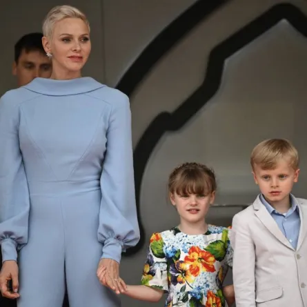 Princess Charlene (L) of Monaco stands with her children Jacques and Gabriella at the Monaco street circuit in Monaco, on May 29, 2022. LOIC VENANCE / AFP