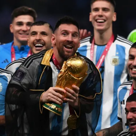 Argentina's forward #10 Lionel Messi lifts the World Cup trophy at Lusail Stadium in Lusail, north of Doha on December 18, 2022. Argentina won in the penalty shoot-out. FRANCK FIFE / AFP