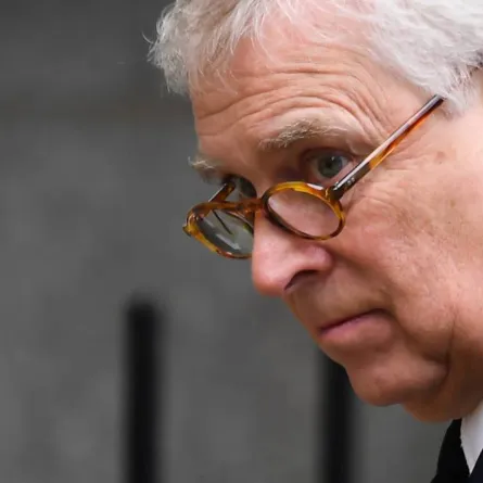 Britain's Prince Andrew, Duke of York looks at the flowers layed outside Balmoral Castle in Ballater, on September 10, 2022, ANDY BUCHANAN / AFP