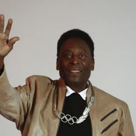 FILES) In this file photo taken on June 16, 2016, Brazilian retired footballer Edson Arantes do Nascimento, know as Pele, waves after being decorated with an Olympic Order Medal at the Pele Museum in Santos, Sao Paulo, Brazil. Football legend Pele gave Brazil a virtual pre-match pep talk Thursday November 24, 2022, as the national team prepared to make their World Cup debut, telling them: "Bring this trophy home." Miguel Schincariol / AFP