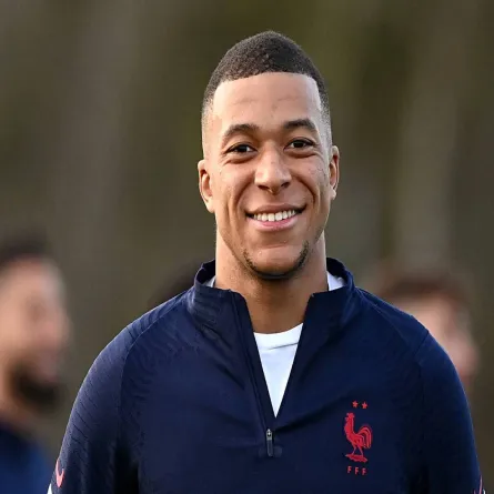 AFP via Getty ImagesJULIEN DE ROSA/AFP/AFP via Getty Images Kylian Mbappé celebrates after scoring a last-minute penalty for PSG in his first match since the World Cup final.