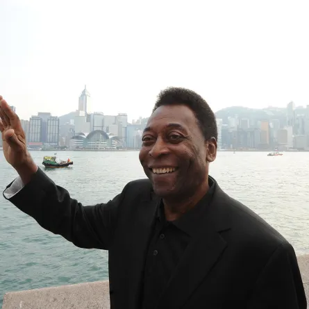 Retired football star Pele of Brazil poses for a photo before the Hong Kong skyline in the Kowloon district of the city on March 7, 2011. Pele is in town on a goodwill visit as part of the 2011 New York Cosmos Asia Tour. AFP PHOTO/MIKE CLARKE Mike CLARKE / AFP