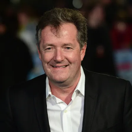 British journalist and television personality Piers Morgan poses for a photograph as he arrives for the European premiere of Eddie The Eagle in London on March 17, 2016. LEON NEAL / AFP