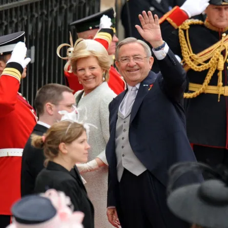 Former King Constantine of Greece waves as he arrives with his wife Anna-Marie at the West Door of Westminster Abbey in London for the wedding of Britain's Prince William and Kate Middleton, on April 29, 2011. AFP PHOTO / BEN STANSALL