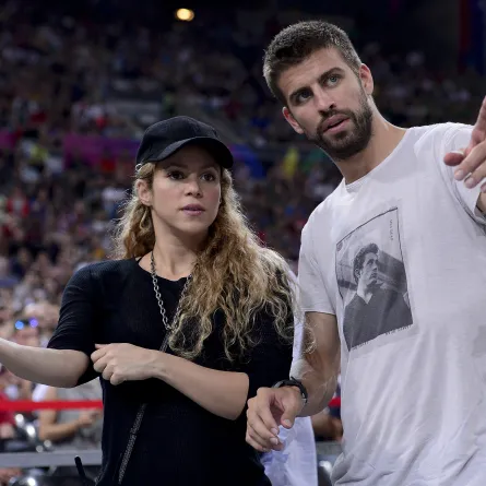 (FILES) In this file photo taken on September 09, 2014, FC Barcelona's defender Gerard Pique (R) and his wife Colombian singer Shakira at the Palau Sant Jordi arena in Barcelona.  Josep LAGO / AFP
