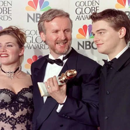 Director James Cameron(C) and actress Kate Winslet(L) and actor Leonardo DiCaprio(R) pose for photographers after Cameron won the award for Best Director for "Titanic" at the 55th Annual Golden Globe Awards at the Beverly Hilton 18 January in Beverly Hills. AFP PHOTO Hal GARB