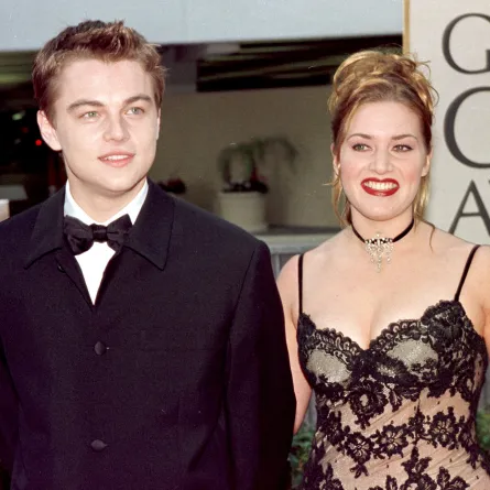 Actor Leonardo DiCaprio (L) arrives with actress and Titanic co-star Kate Winslet for the 55th Annual Golden Globe Awards at the Beverly Hilton 18 January 1998 in Beverly Hills, HAL GARB / AFP