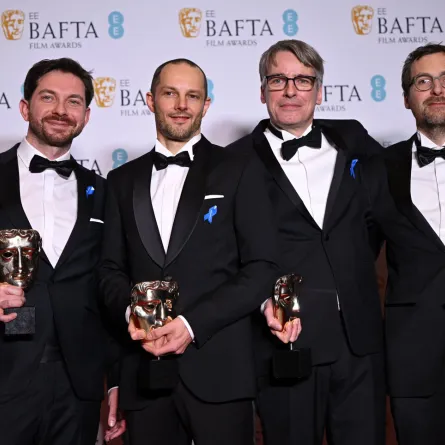 Viktor Prasil, Markus Stemler, Frank Kruse and Lars Ginzel pose with their awards for 'All Quiet on the Western Front' during the BAFTA British Academy Film Awards ceremony at the Royal Festival Hall, Southbank Centre, in London, on February 19, 2023. JUSTIN TALLIS / AFP