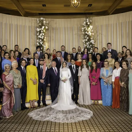   A handout picture released by Jordan's Royal Palace shows King Abdullah II (7th L) and Queen Rania (6th R) posing for a picture with members of the Jordanian royal family and the bride and groom, during the wedding ceremony of their eldest daughter Princess Iman and Jameel Alexander Thermiotis (C) in Amman on March 12, 2023. Thermiotis, who was born in 1994 in Venezuela to a family of Greek origin, currently works in the field of finance in New York. AFP PHOTO / JORDANIAN ROYAL PALACE