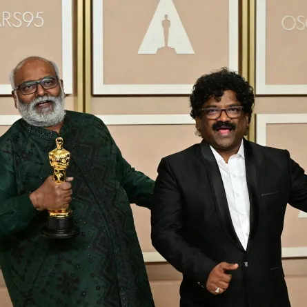 M.M. Keeravaani (L) and Chanrabose (R) at the Dolby Theatre in Hollywood, California on March 12, 2023. Frederic J. Brown / AFP