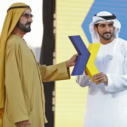 Sheikh Mohammed bin Rashid Al-Maktoum (L), and the Emirate's Crown Prince Sheikh Hamdan bin Mohammed bin Rashid Al-Maktoum (R), hold the new logo of Dubai Airoprt, in Dubai, on February 13, 2019. KARIM SAHIB / AFP